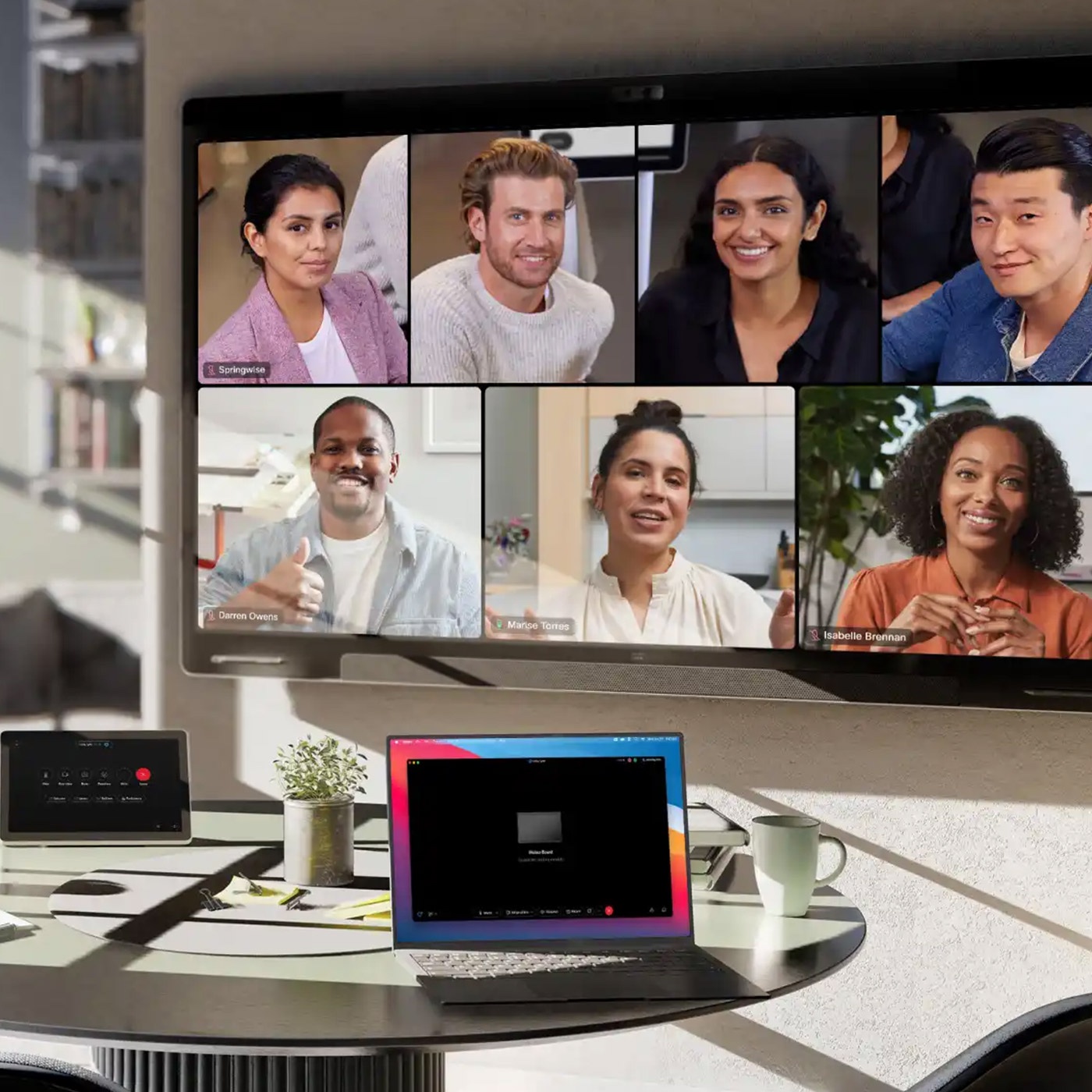 Video conference launches in open meeting space using Cisco Devices and intelligent camera frames view.