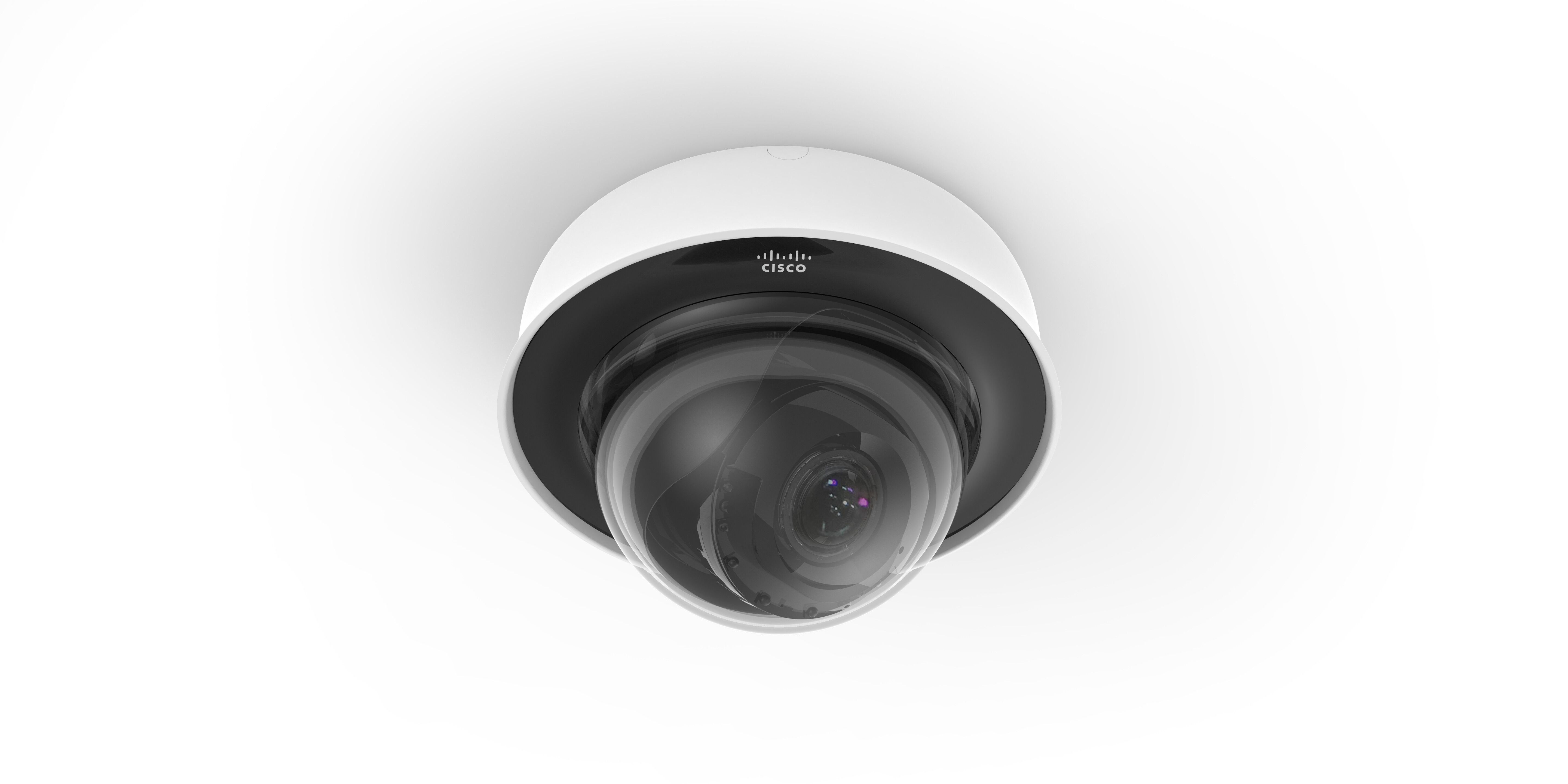 The MV22 smart camera mounted to the ceiling via its white base. The black camera is visible inside its clear dome covering.
